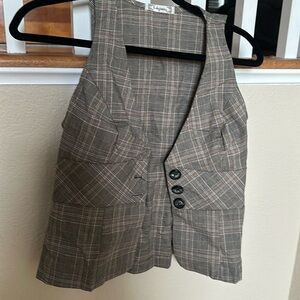 Plaid vest with white metal buckle in back